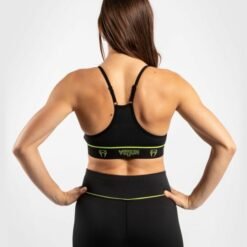 Women's sports bra Venum black with a yellow logo on the front